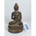 AN ORIENTAL METAL FIGURE OF A SEATED BUDDHA, 13 CM TALL.