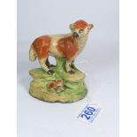 LATE 18TH / EARLY 19TH CENTURY STAFFORDSHIRE CERAMIC FIGURE OF A SHEEP AND LAMB. 11.5 CM TALL