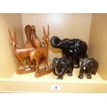 3 EBONY CARVED MODEL ELEPHANTS AND 3 OTHER CARVED FIGURES