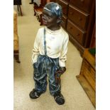 A PLASTER FIGURE OF A BOY, 83 CM TALL