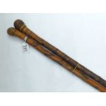 TWO ORIENTAL CARVED BAMBOO WALKING STICKS