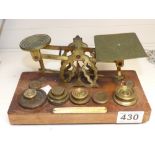 A SET OF BRASS POSTAL SCALES AND WEIGHTS