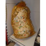 KILOWARE - A LARGE QUANTITY OF USED POSTAGE STAMPS IN A SACK