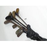 8 GOLF CLUBS INCLUDING THREE HICKORY SHAFT GOLF CLUBS. ONE HAS THE MARKINGS "FORT MASON PICCADILY