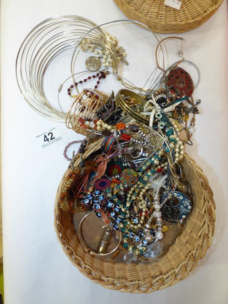 A BASKET OF COSTUME JEWELLERY