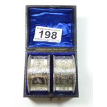 A PAIR OF SILVER NAPKIN RINGS IN THEIR ORIGINAL BOX, SHEFFIELD 1894/5, MADE BY AITKIN BROTHERS.