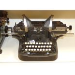 AN UNUSUAL TYPREWRITER, "THE BRITISH OLIVER", 56 CM WIDE AND 28CM TALL