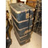 A METAL BOUND TRAVEL TRUNK