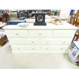 A PAINTED PINE 7 DRAWER CHEST (152 X 52 CM)