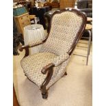 A LATE 19TH / EARLY 20TH CENTURY ARMCHAIR WITH FLORAL PATTERNED FABRIC. 100 CM TALL