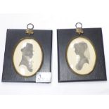A PAIR OF OVAL SILHOUETTE PORTRAITS, SIGNED ENID ELLIOT LINDER, FRAMES ARE 14 X 13 CM