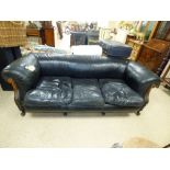 A 20TH CENTURY BLACK LEATHER SOFA WITH VICTORIAN FRAME, RAISED ON WOODEN SUPPORTS, APPROX 200CM