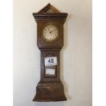 A CARVED WOODEN MINIATURE GRANDFATHER CLOCK (A/F)