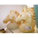 A PAIR OF LACQUERED CERAMIC HORSE HEADS