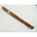 A WOODEN TRUNCHEON - 39 CM IN LENGTH