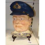 A PLASTER ADVERTISING WALL PLAQUE FOR SENIOR SERVICE CIGARETTES, MEASURES 35.5 X 25 CM