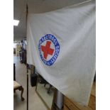 A LARGE BRITISH RED CROSS SOCIETY YOUTH PARADE FLAG ON POLE. POLE IS 233 CM LONG