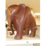 A CARVED WOODEN FIGURE OF AN ELEPHANT