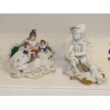 A CAPODIMONTE FIGURE OF A SEATED BOY (21CM) AND AN EARLY 20TH CENTURY CONTINENTAL PORCELAIN GROUP OF