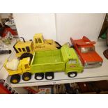FOUR TONKA TOYS INCLUDING A MIGHTY LOADER, CEMENT MIXED, DUMP TRUCK AND FLATBED VAN