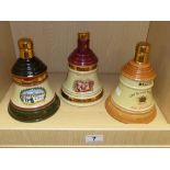 THREE EMPTY WADE BELLS WHISKY DECANTERS FROM CHRISTMAS 1989, 1996 AND AN UNDATED EXAMPLE