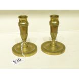 A PAIR OF 20TH CENTURY BRASS EMPIRE STYLE CANDLESTICKS CONVERTED TO LAMP BASES (13 CM)