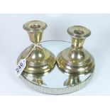 A PAIR OF SILVER SQUAT CANDLESTICKS, HALLMARKED BIRMINGHAM 1919 BY WILLIAM HUTTON AND SONS, ONE AF