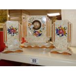 AN ART DECO STYLE CERAMIC CLOCK AND GARNITURE