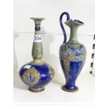 AN EARLY 20TH CENTURY ROYAL DOULTON BOTTLE VASE AND A SIMILAR EWER, TALLEST 29CM