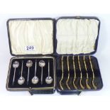 A CASED SET OF 6 SILVER COFFEE SPOONS AND A SET OF 6 GILT METAL PARTY FORKS