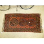 A PERSIAN WOOL RUG 140CM BY 72CM