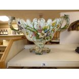 A LARGE CERAMIC TWIN HANDLED JARDINIERE DECORATED WITH FLORAL SCENES. (BASE A/F) 70CM WIDE BY 43CM