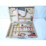 A WOODEN TOOL BOX WITH TOOLS
