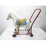 A TRIANG PUSH ALONG PLASTIC SIT ON HORSE TOY WITH METAL FRAME