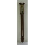 A 19th century mahogany stick barometer with silvered dial and cast urn finial