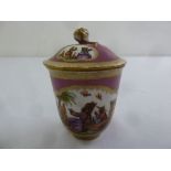 A 19th century Meissen cup and cover decorated with Oriental figures and applied flowers, signed