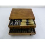 A cased canteen of silver plated flatware for eight persons to include knives, forks, spoons and