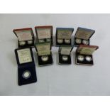 A quantity of silver proof coins to include 1990 5p two coin set, 1992 10p two coin set, 1982 20p