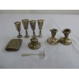 A quantity of silver to include Kiddush cups, a cigarette case, dwarf candlesticks and an inkwell