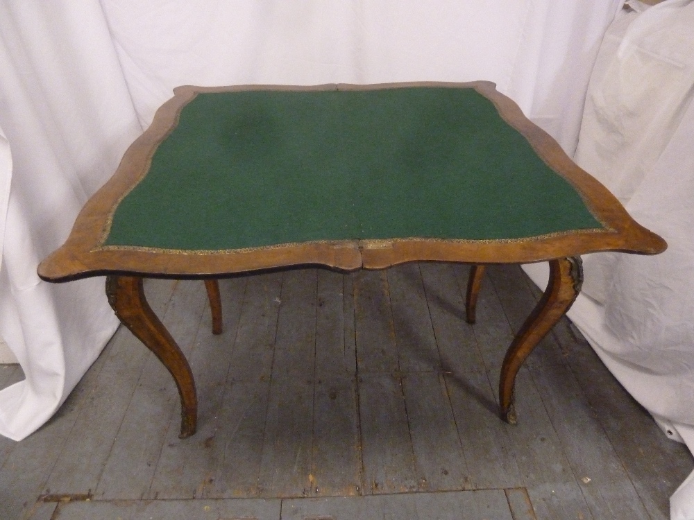 A Victorian rectangular walnut card table, inlaid hinged top on four cabriole legs - Image 2 of 2