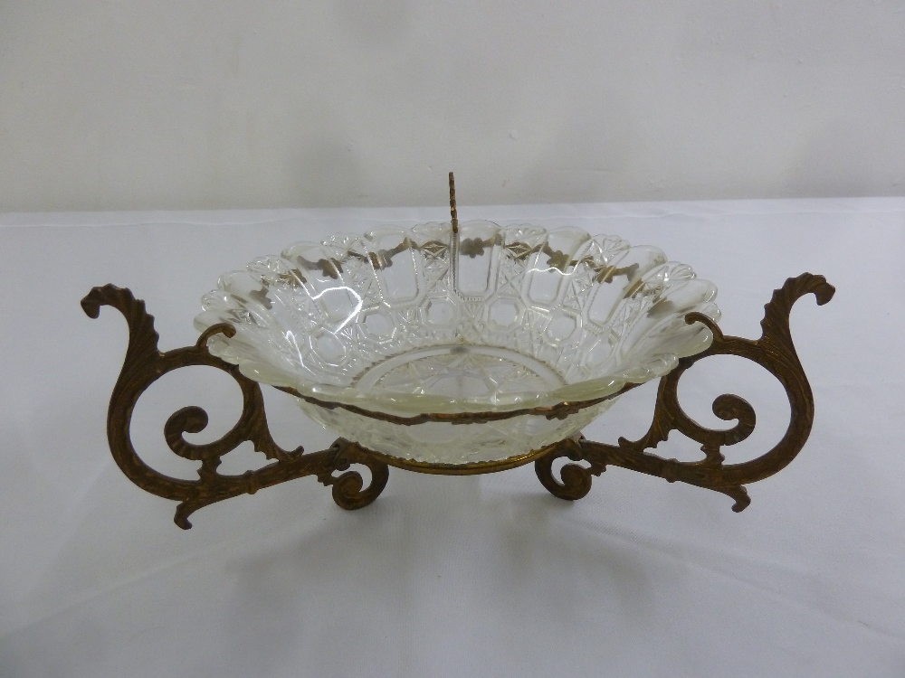 Gilded metal and glass circular table centre piece with three scrolling supports