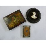 A 19th century rectangular lacquered box decorated with courting scenes, a carved mounted silhouette