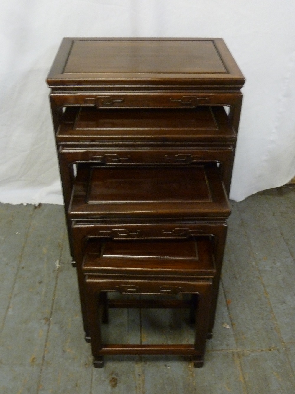 A nest of four Oriental rectangular hardwood tables