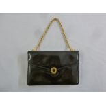 Gucci ladies black leather evening bag with gilded chain