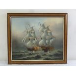 A framed oil on canvas of Galleons battling, indistinctly signed bottom right, 50 x 60cm
