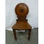 A Victorian mahogany hall chair on four turned legs