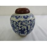 A Chinese late 19th century blue and white ginger jar with cinnabar lacquer carved cover, marks to