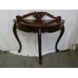 A mahogany D shaped hall table with gadrooned border on three cabriole legs