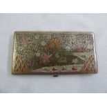 A Persian rectangular white metal cigarette case engraved with animals and flowers