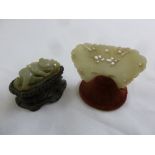 Two Chinese jade carvings, one of a butterfly the other of a recumbent figure